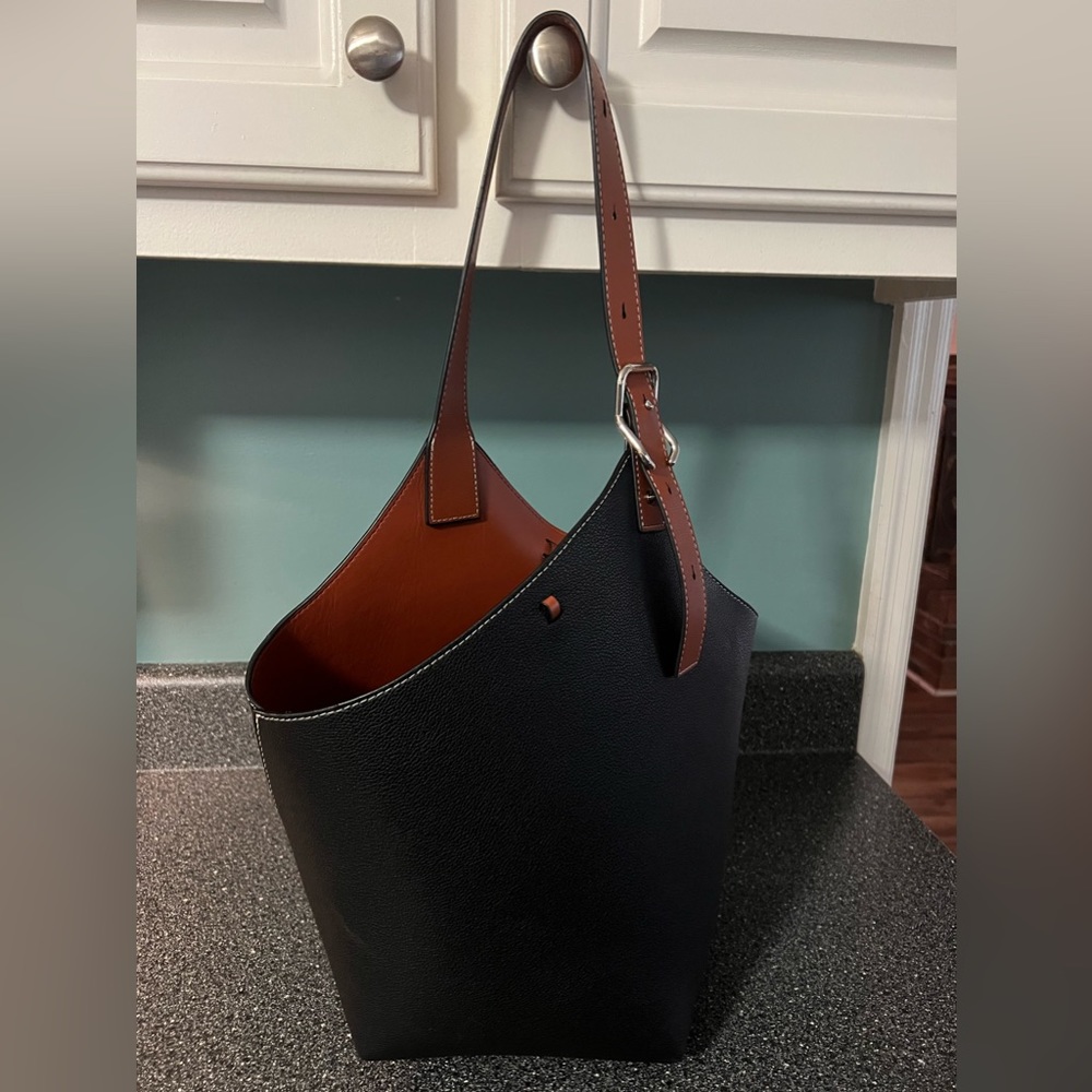 Black leather hobo purse.